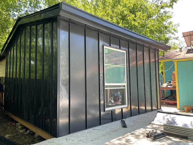 Black standing seam metal wall panels for Roof Inspection in Little Canada